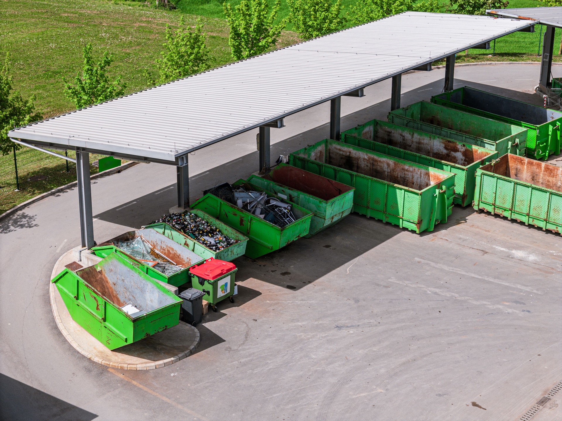 Waste Disposal Area with Green Dumpsters